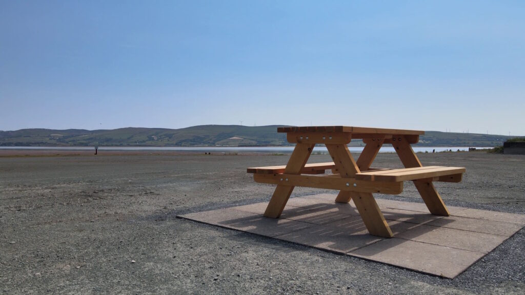 Wooden benches on a beach by the Duddon Estuary